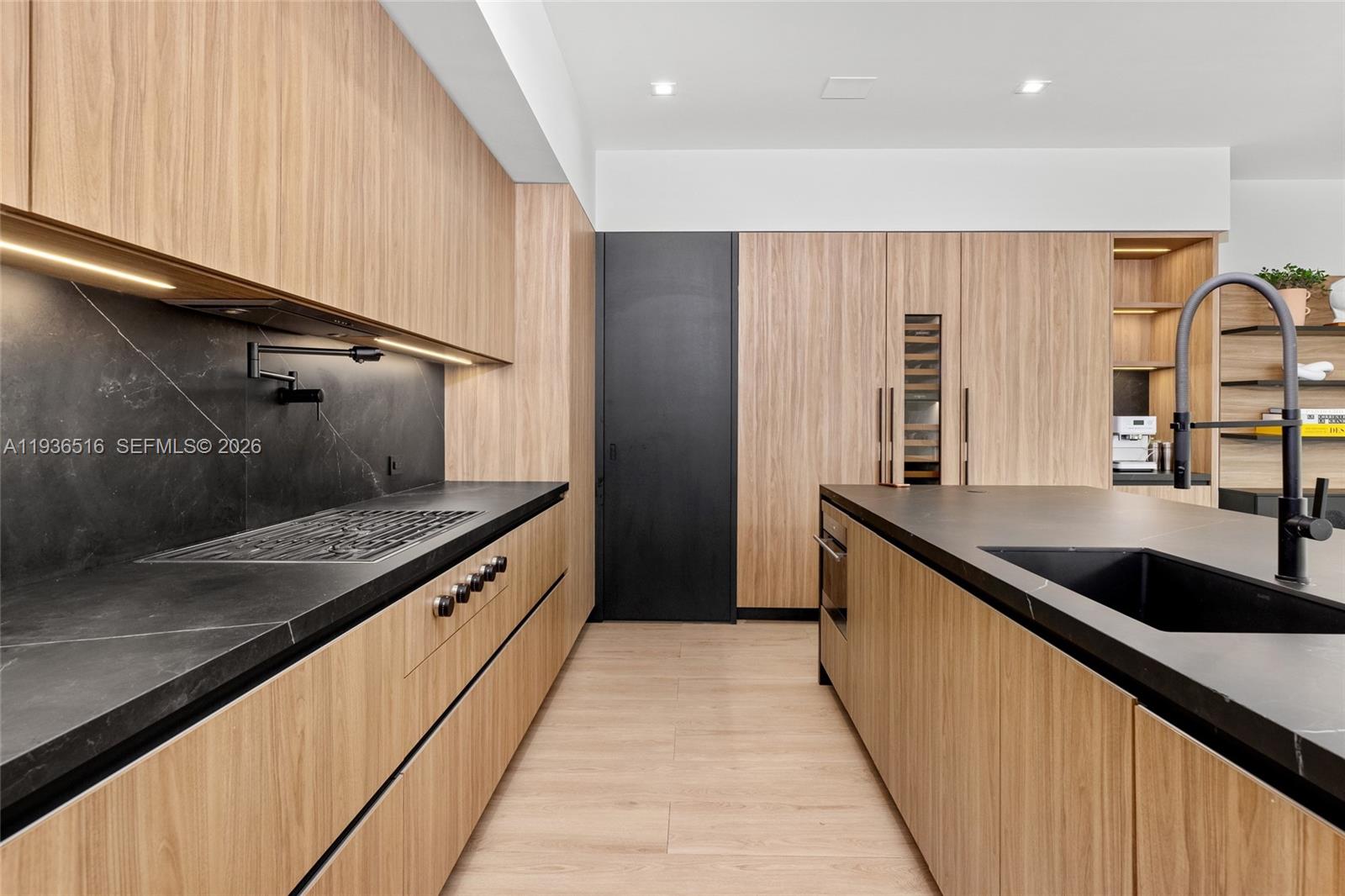 6003 Southwest 80th Street South Miami, FL 33143 - Photo 28 of 98 a large kitchen with stainless steel appliances granite countertop a sink and a stove top oven