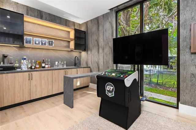 a bedroom with a large bed and a large window