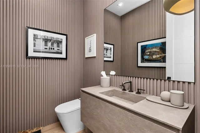 a large bathroom with a large tub shower double vanity sink and mirror