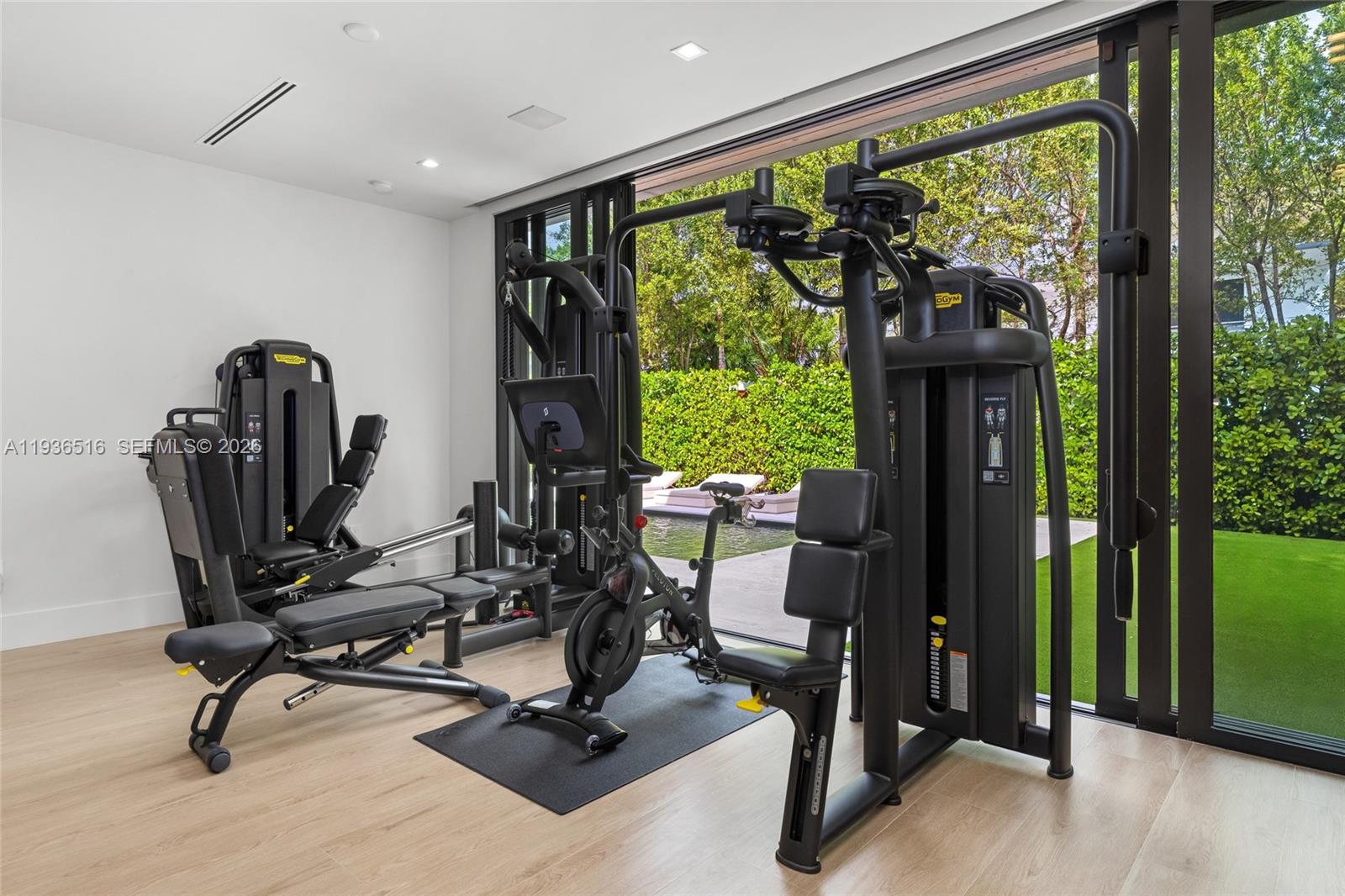 6003 Southwest 80th Street South Miami, FL 33143 - Photo 35 of 98 a view of a room with gym equipment