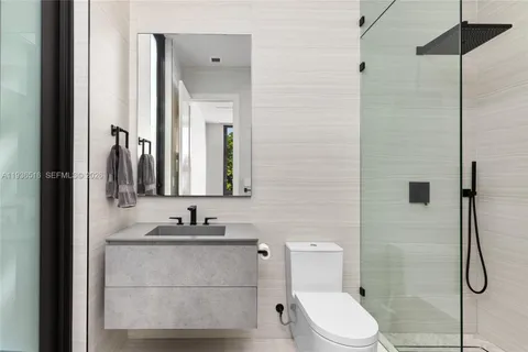 an aerial view of a house with a yard and garden