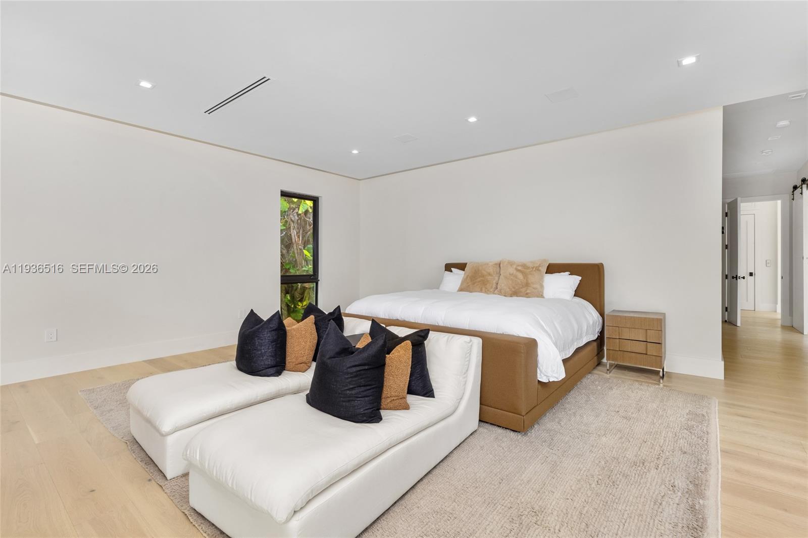 6003 Southwest 80th Street South Miami, FL 33143 - Photo 45 of 98 a bedroom with a bed and a table