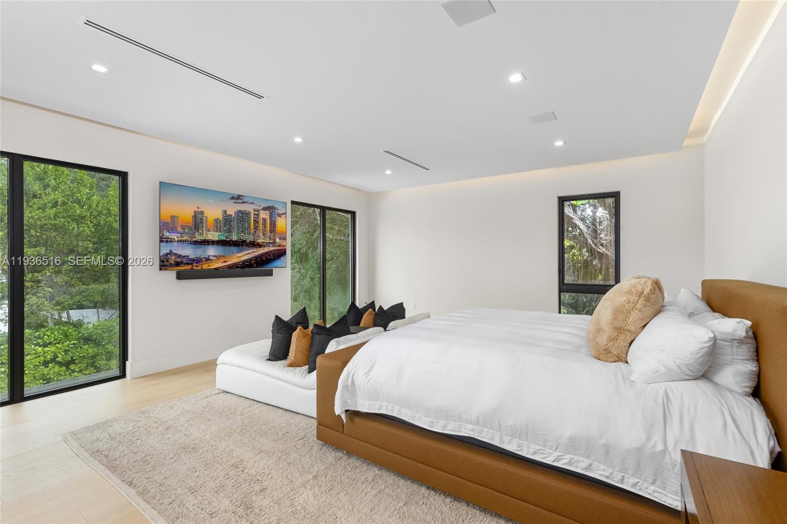 6003 Southwest 80th Street South Miami, FL 33143 - Photo 46 of 98 a bedroom with a large bed and a large window