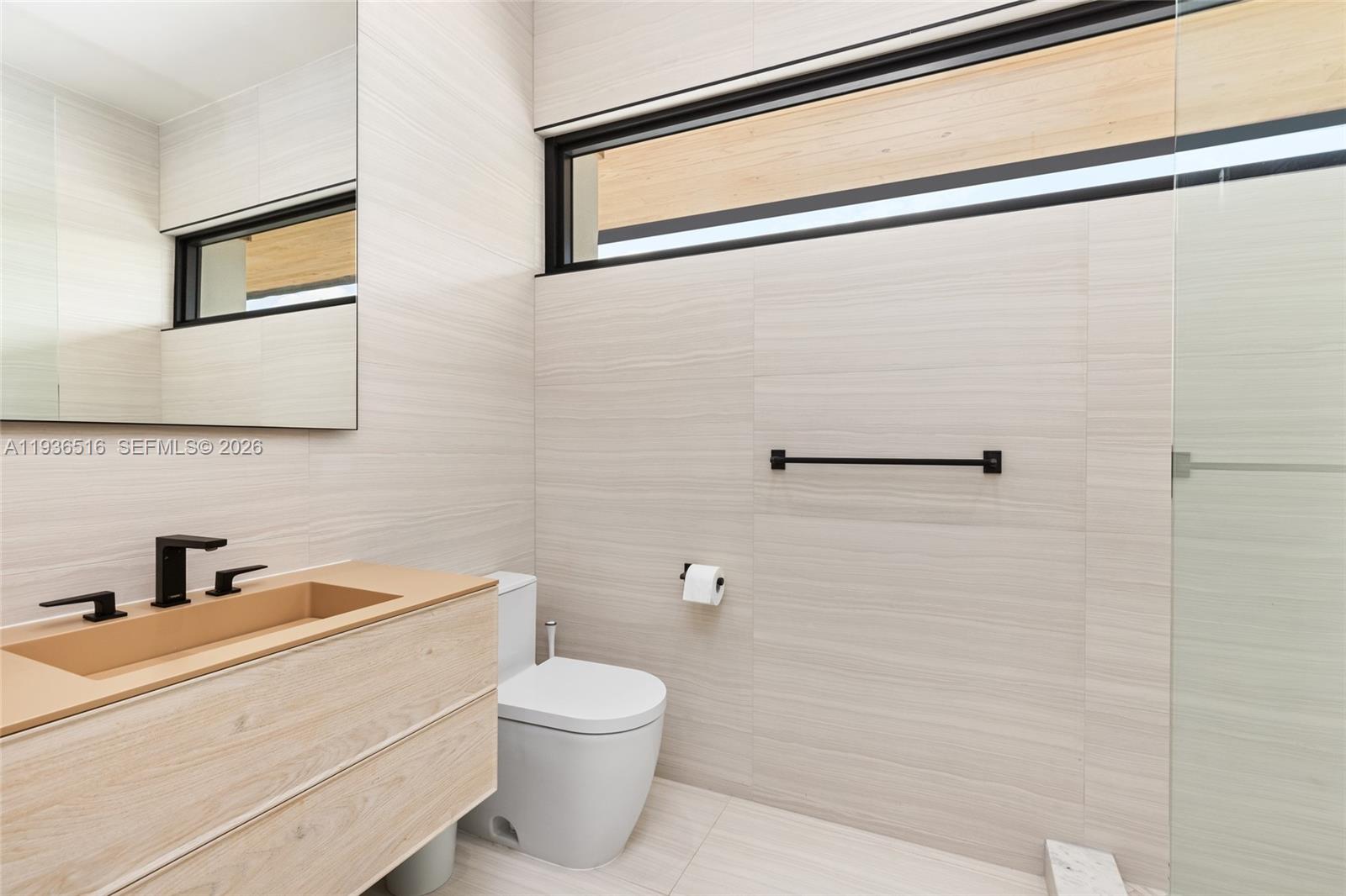 6003 Southwest 80th Street South Miami, FL 33143 - Photo 53 of 98 a bathroom with a toilet sink and shower