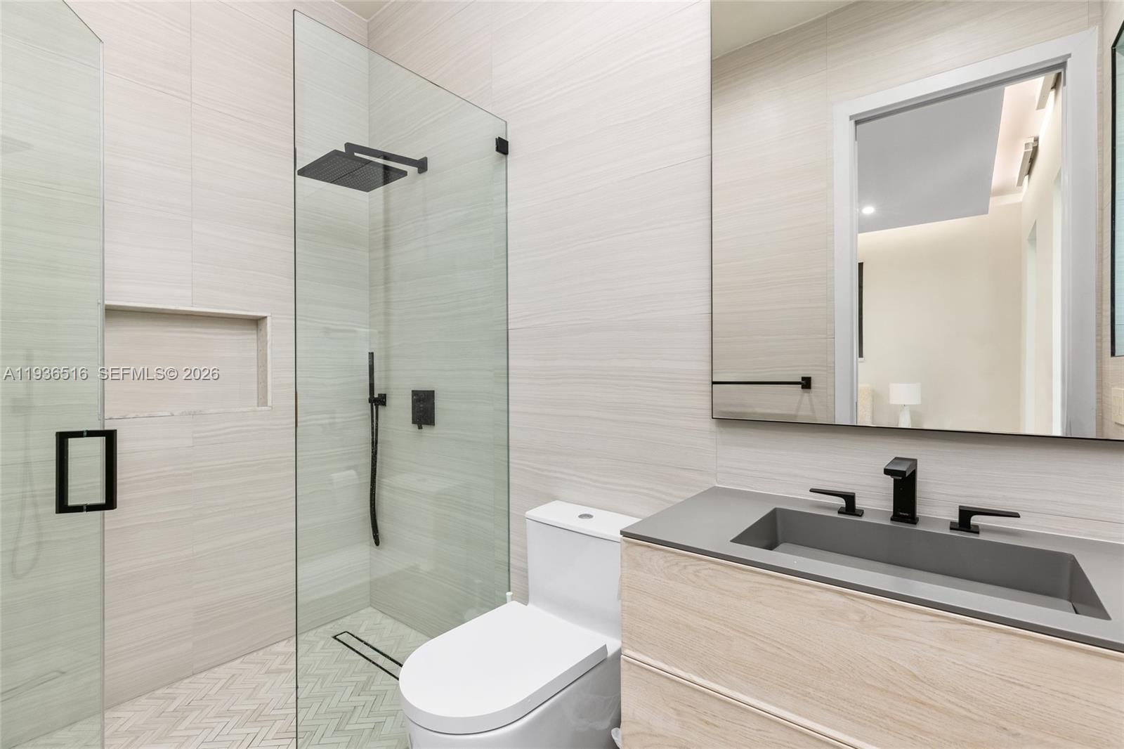 6003 Southwest 80th Street South Miami, FL 33143 - Photo 55 of 98 a bathroom with a sink a toilet and shower