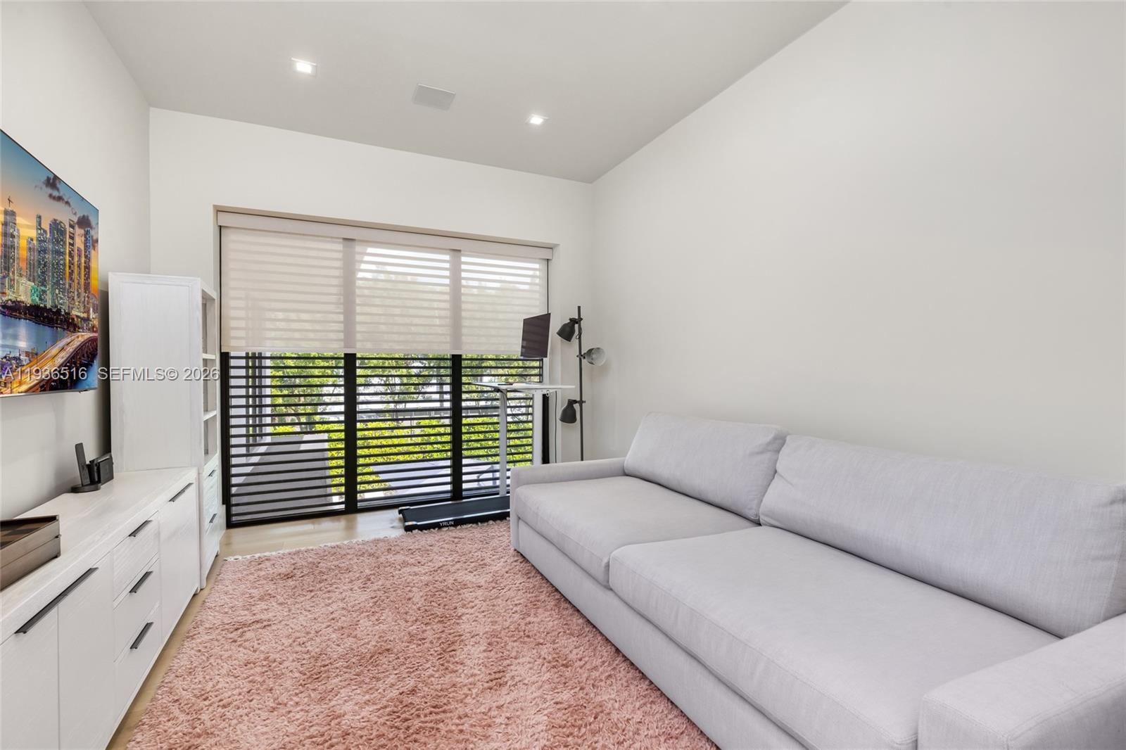 6003 Southwest 80th Street South Miami, FL 33143 - Photo 58 of 98 a living room with furniture and a flat screen tv