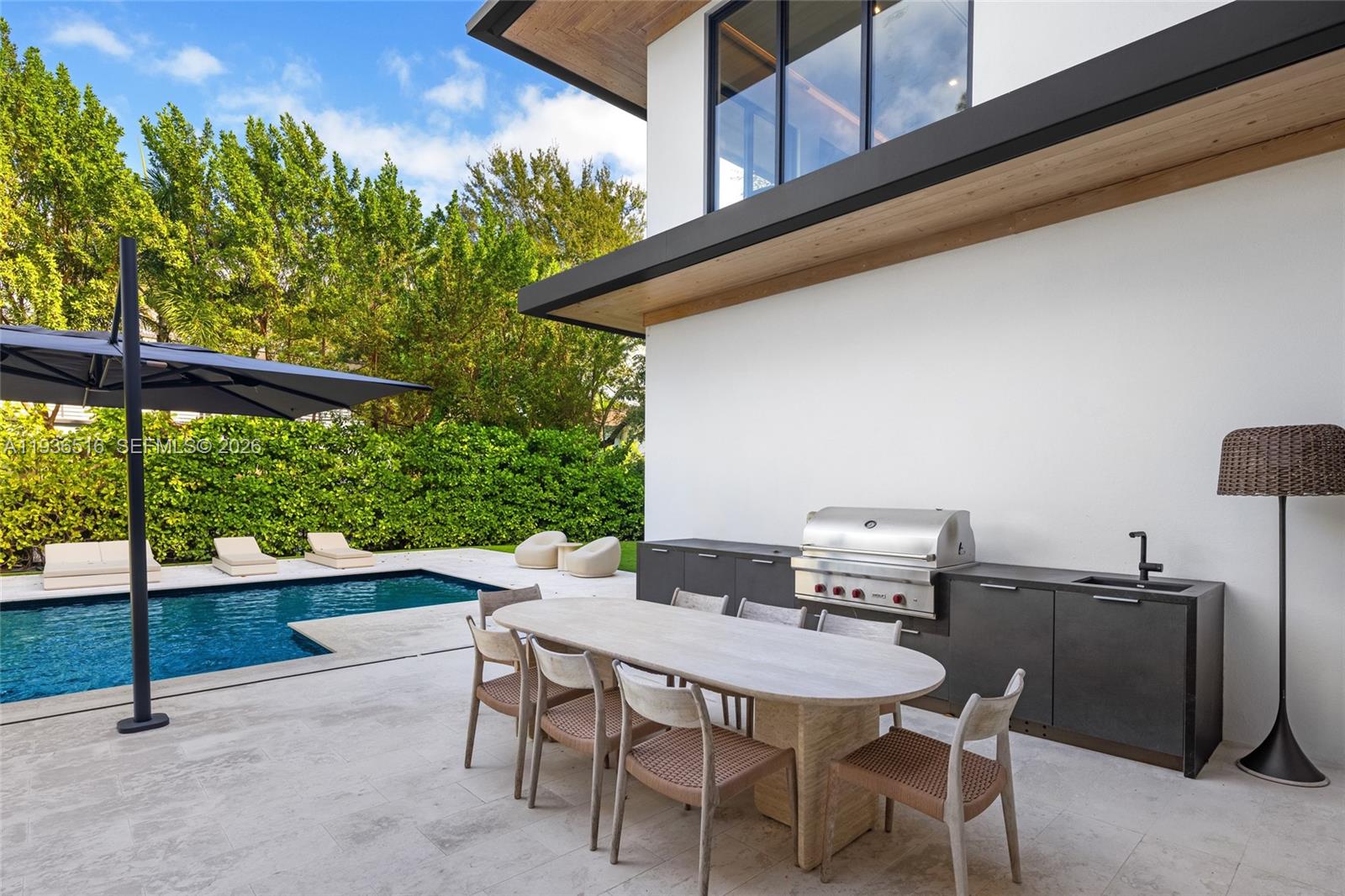 6003 Southwest 80th Street South Miami, FL 33143 - Photo 68 of 98 a view of an outdoor space with a table and chairs