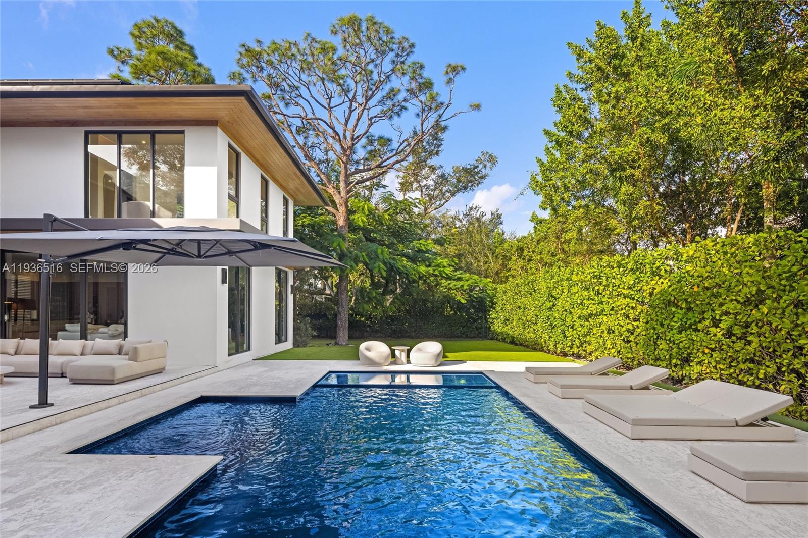 6003 Southwest 80th Street South Miami, FL 33143 - Photo 72 of 98 a view of a house with a yard