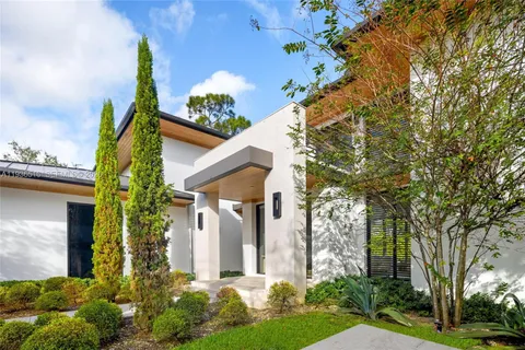 a outdoor dining space with furniture and a potted plant