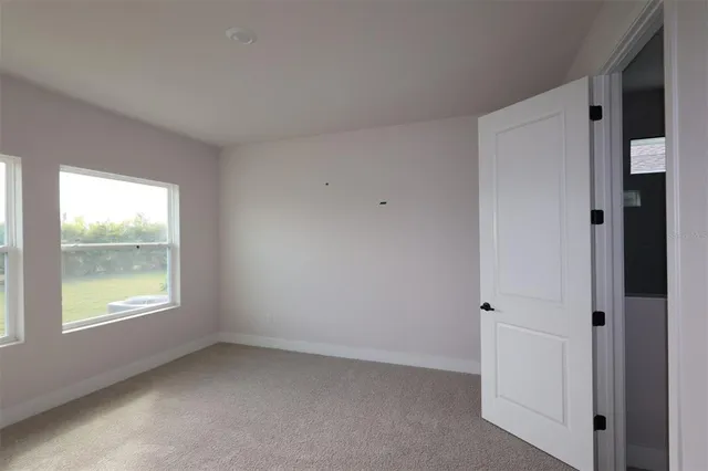 a bathroom with a sink a light fixture and a mirror