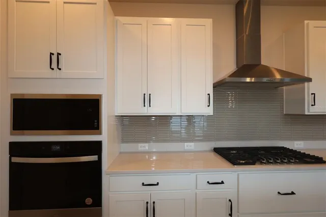a bathroom with a sink and cabinets
