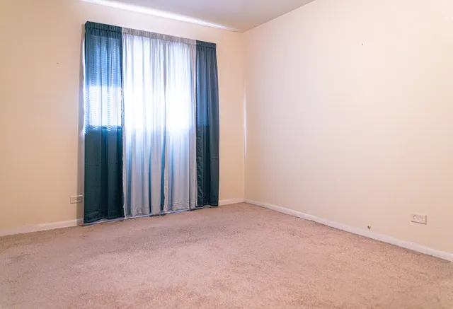 a view of an empty room and window