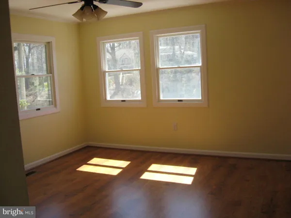 a view of empty room with windows