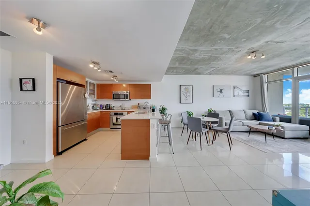 a living room with furniture a dining table and chairs