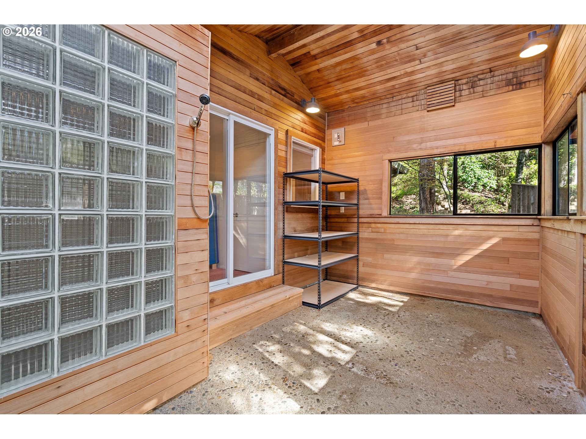 214 Northwest Seblar Drive Portland, OR 97210 - Photo 19 of 36 a view of empty room with windows and lounge chair