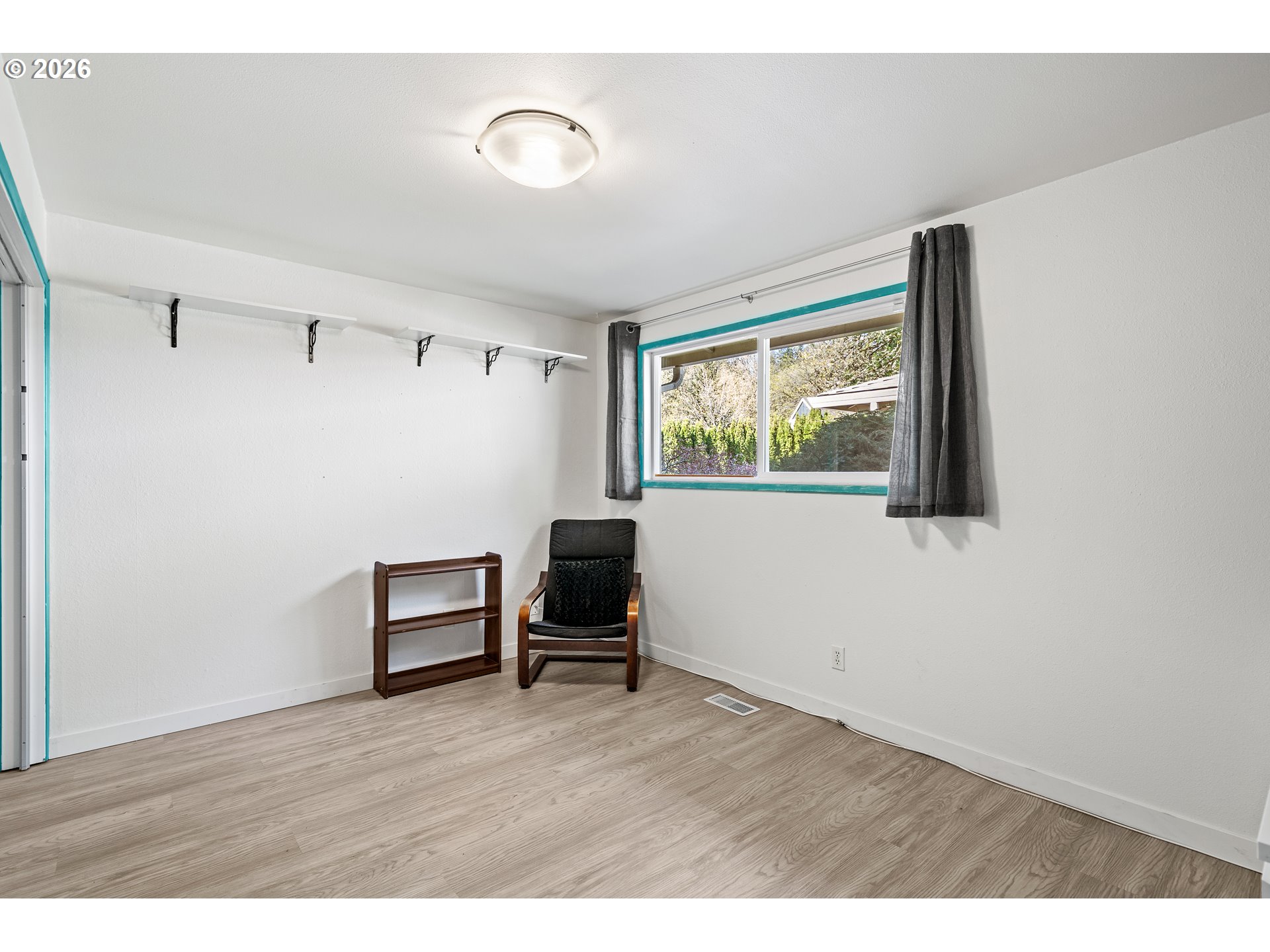 214 Northwest Seblar Drive Portland, OR 97210 - Photo 20 of 36 a view of a livingroom with wooden floor and a window