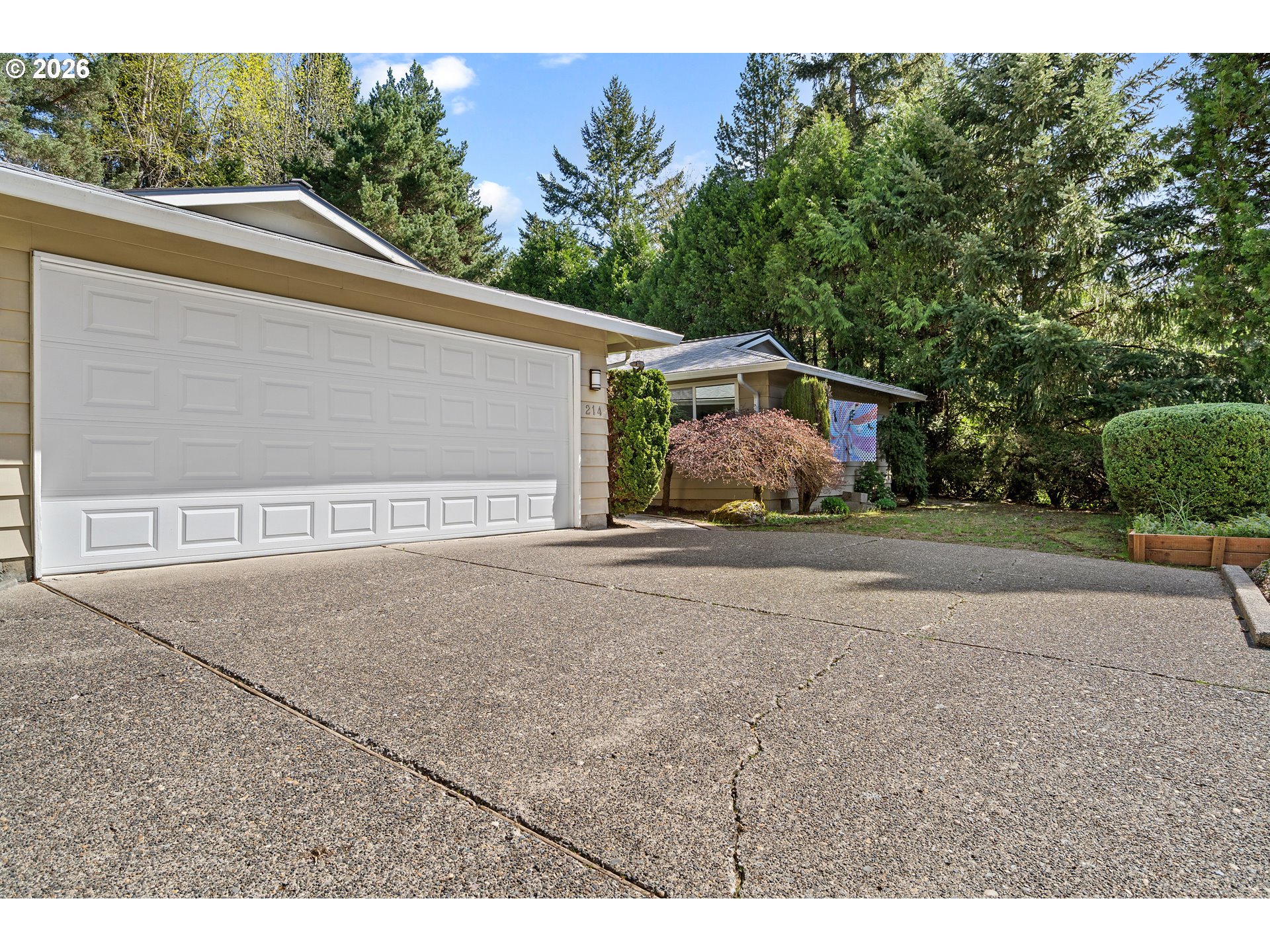 214 Northwest Seblar Drive Portland, OR 97210 - Photo 2 of 36 a front view of a house with a yard and garage