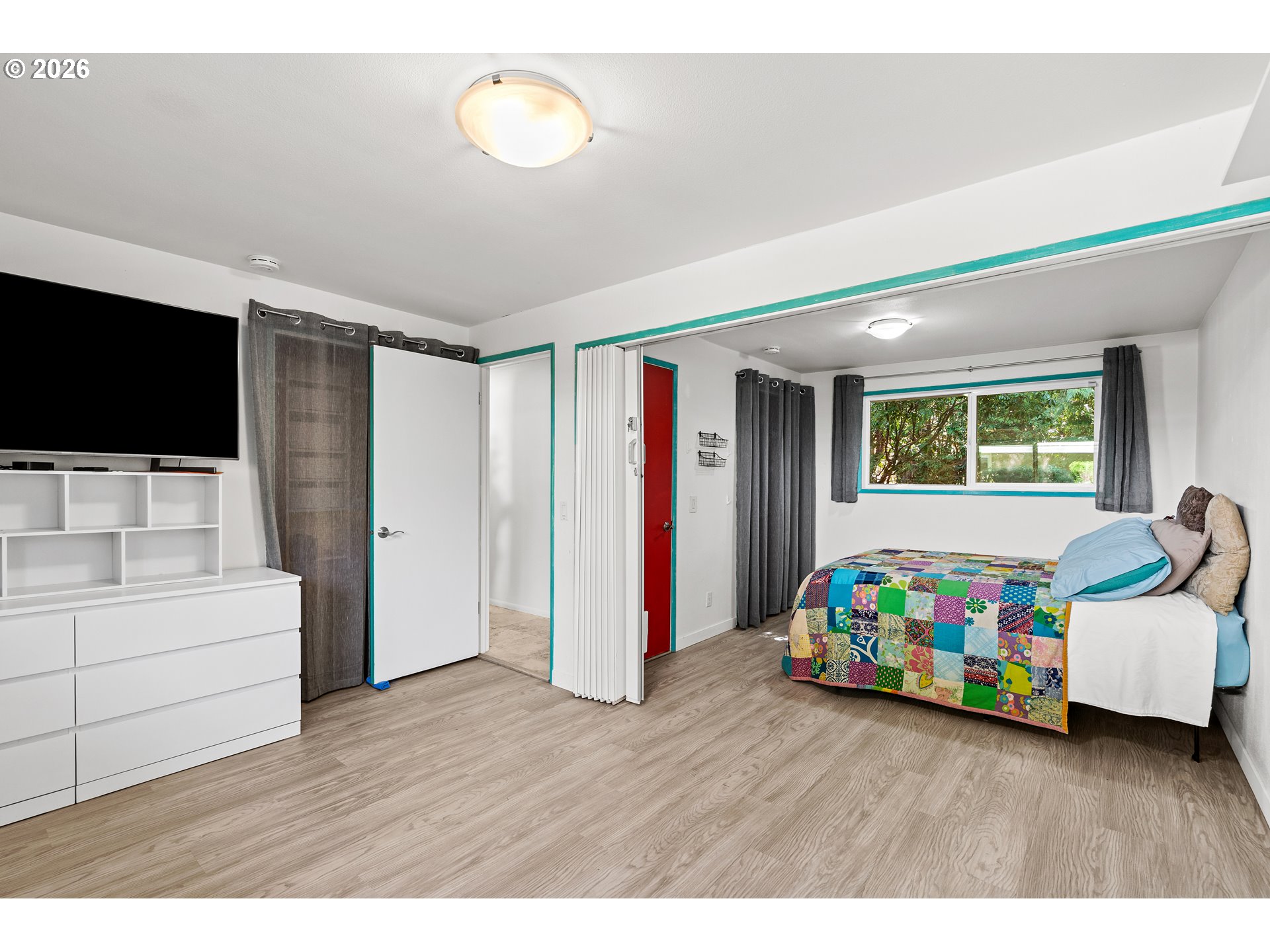 214 Northwest Seblar Drive Portland, OR 97210 - Photo 21 of 36 a living room with furniture and a flat screen tv