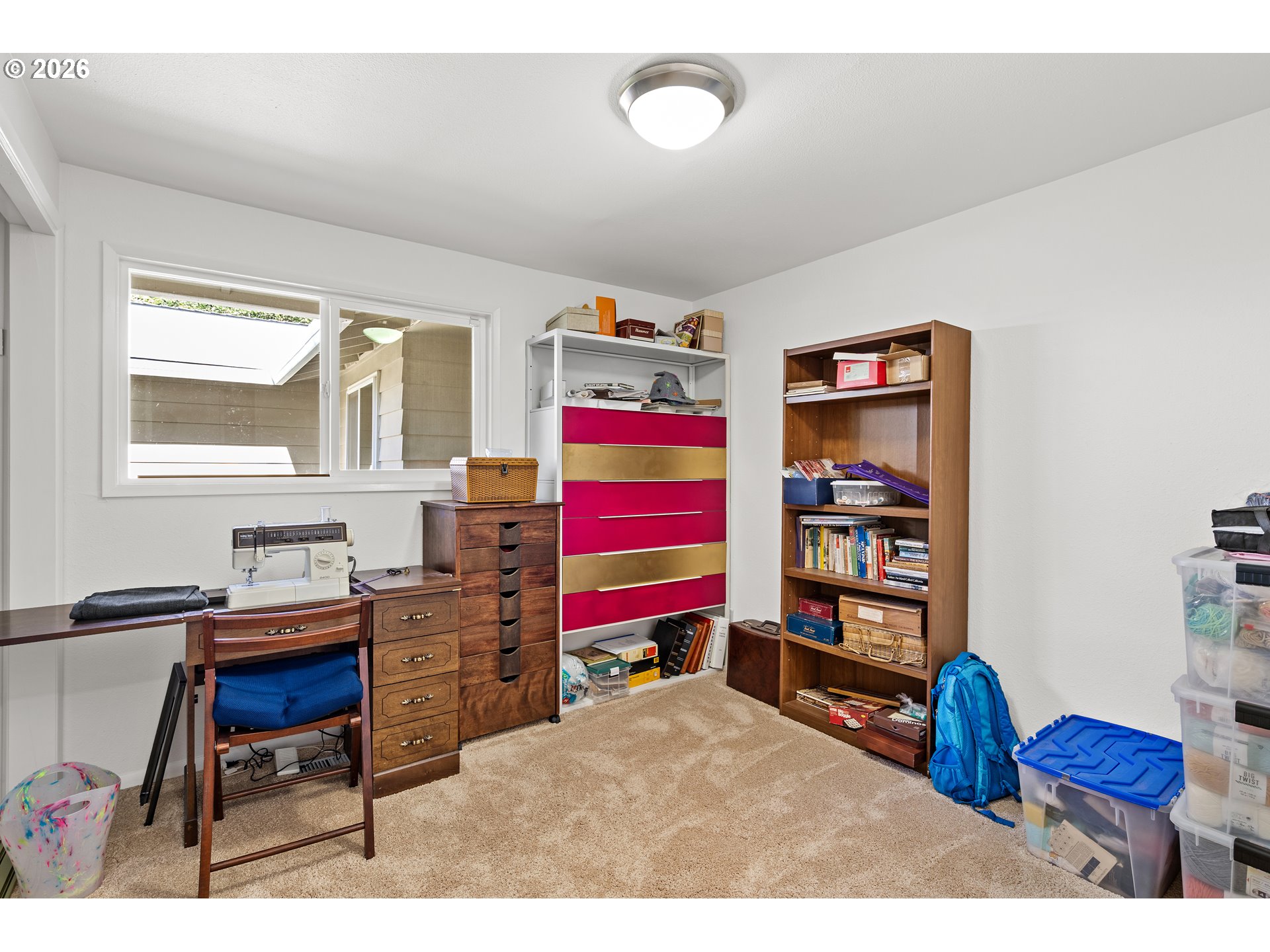 214 Northwest Seblar Drive Portland, OR 97210 - Photo 23 of 36 a living room with furniture and a book shelf