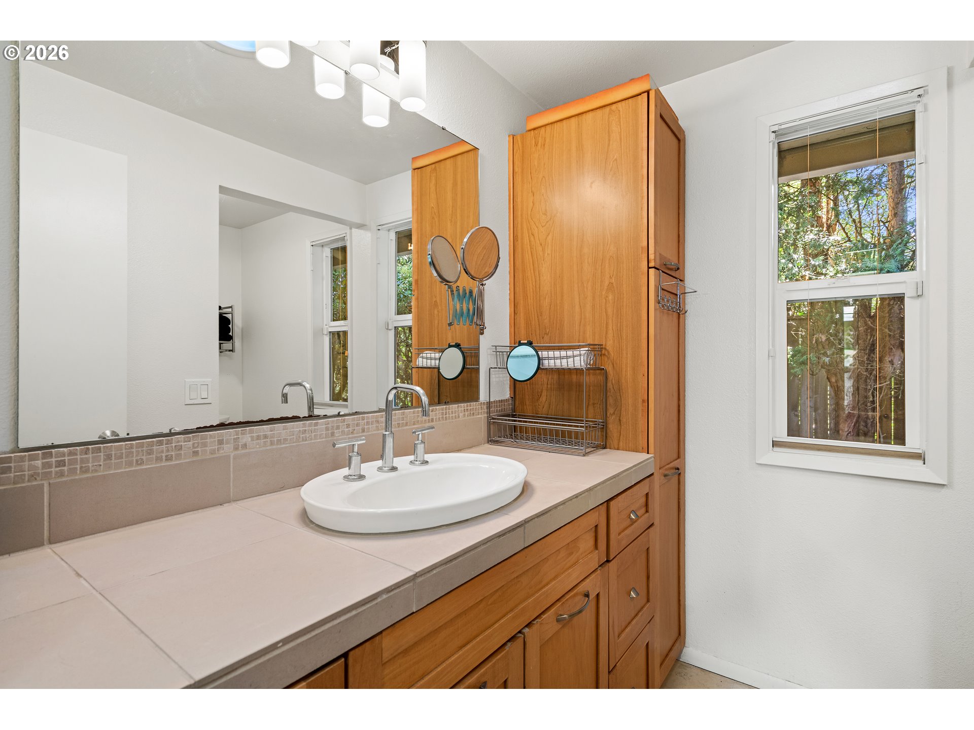 214 Northwest Seblar Drive Portland, OR 97210 - Photo 24 of 36 a bathroom with a sink and a mirror