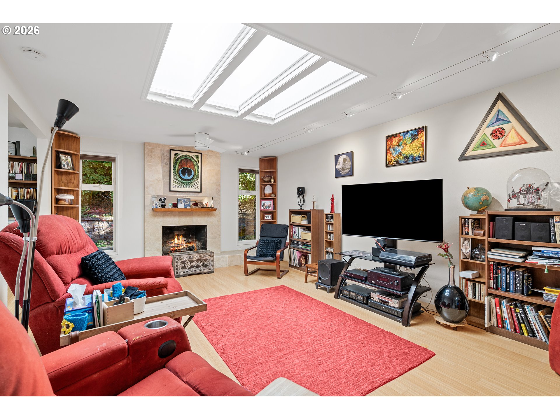 214 Northwest Seblar Drive Portland, OR 97210 - Photo 6 of 36 a living room with furniture a flat screen tv and a fireplace