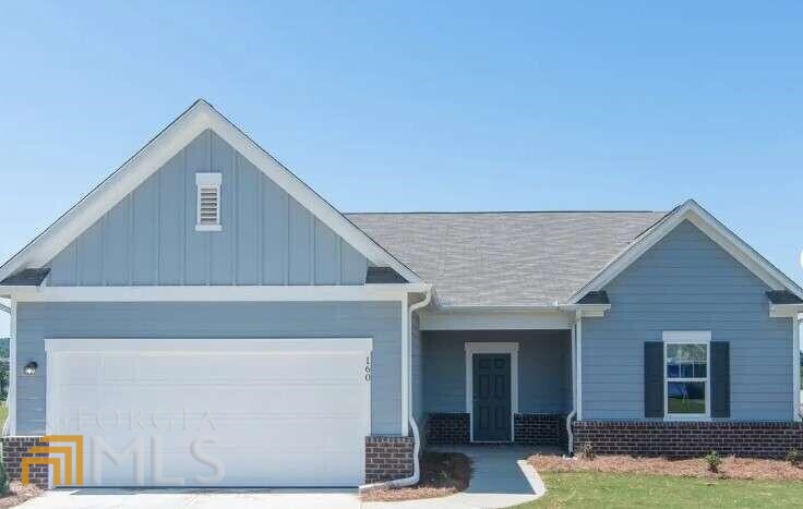 22 Meriwether Drive, Unit 301 Villa Rica, GA 30180 - Photo 1 of 1 a front view of a house with garden