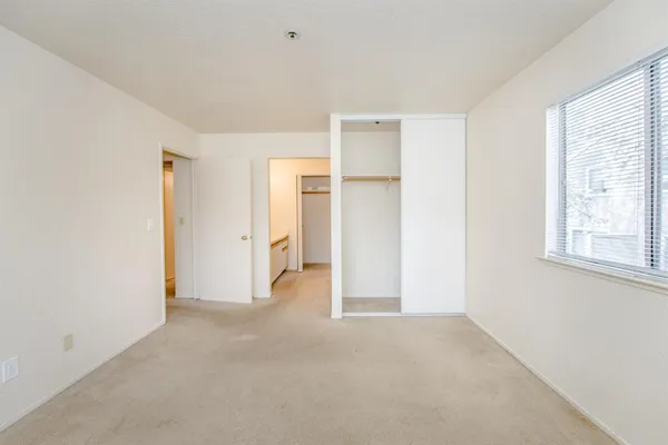 a view of empty room with windows and entryway