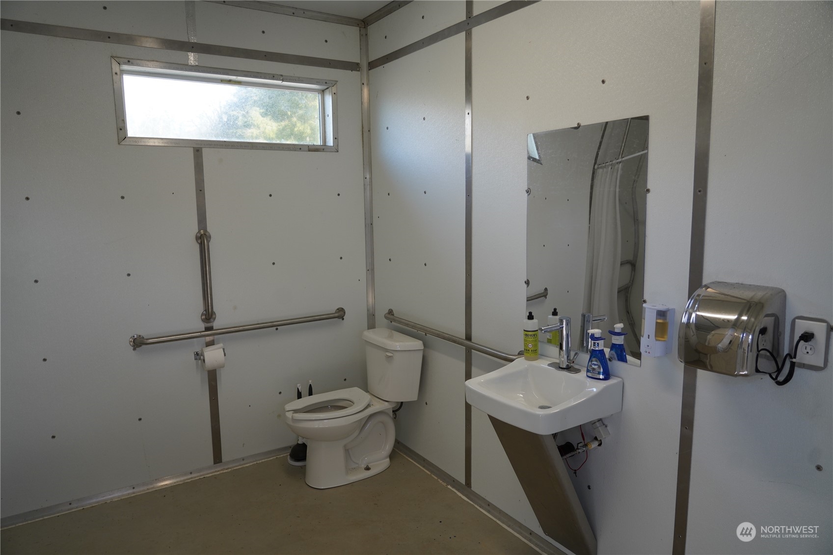 630 Chinook Valley Road Long Beach, WA 98631 - Photo 17 of 27 a bathroom with a sink toilet and a mirror