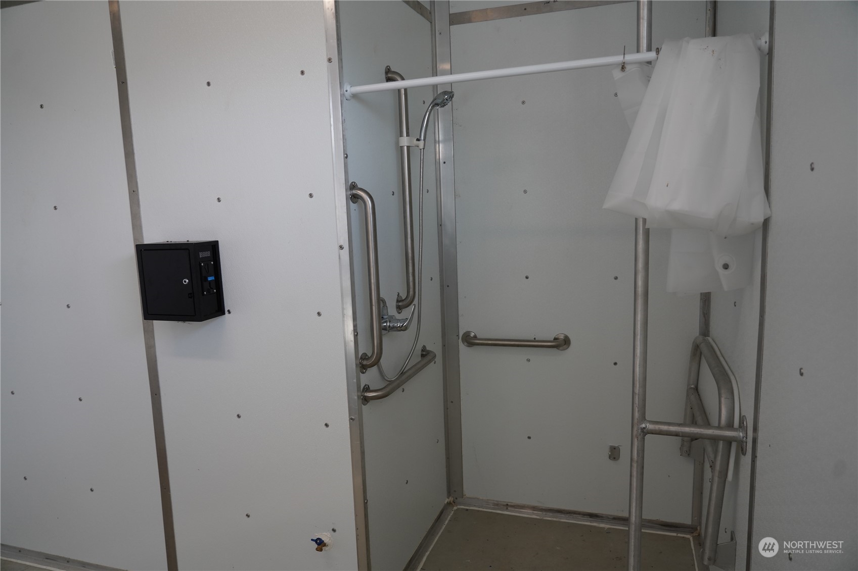 630 Chinook Valley Road Long Beach, WA 98631 - Photo 21 of 27 a bathroom with a shower and a table
