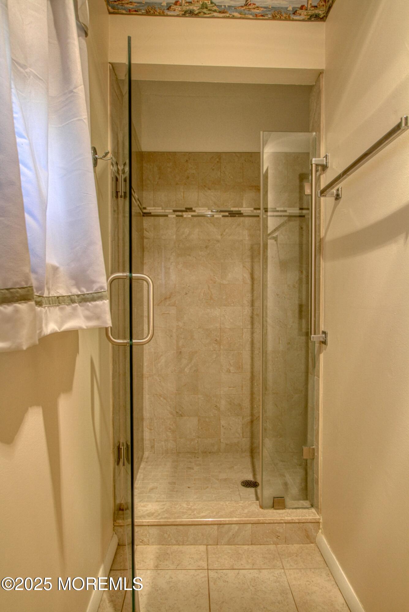 19 Amesbury Road Whiting, NJ 08759 - Photo 11 of 26 a bathroom with a glass shower door