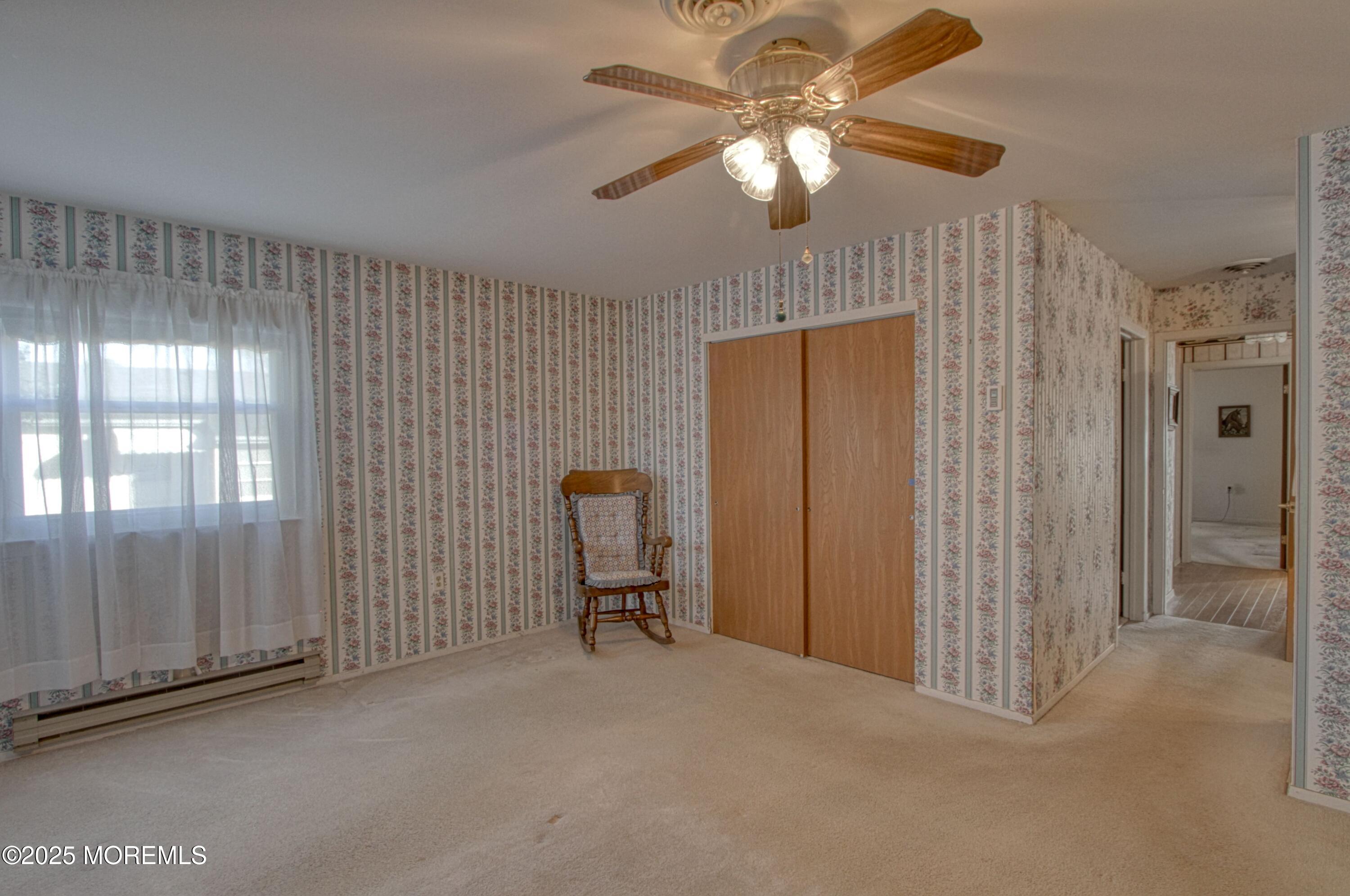 19 Amesbury Road Whiting, NJ 08759 - Photo 13 of 26 a view of a livingroom with a chandelier fan and a window