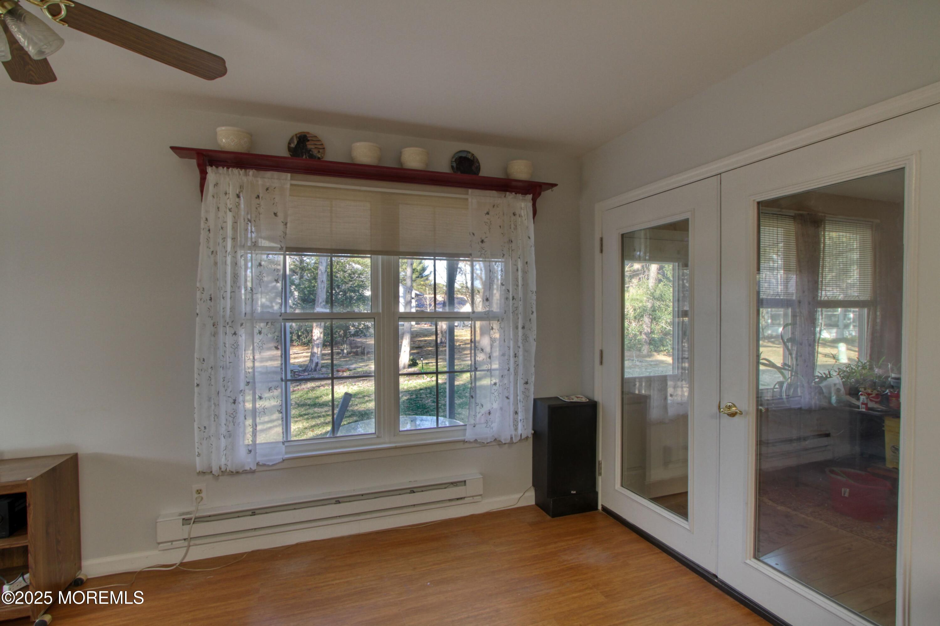 19 Amesbury Road Whiting, NJ 08759 - Photo 6 of 26 a view of an empty room with glass door