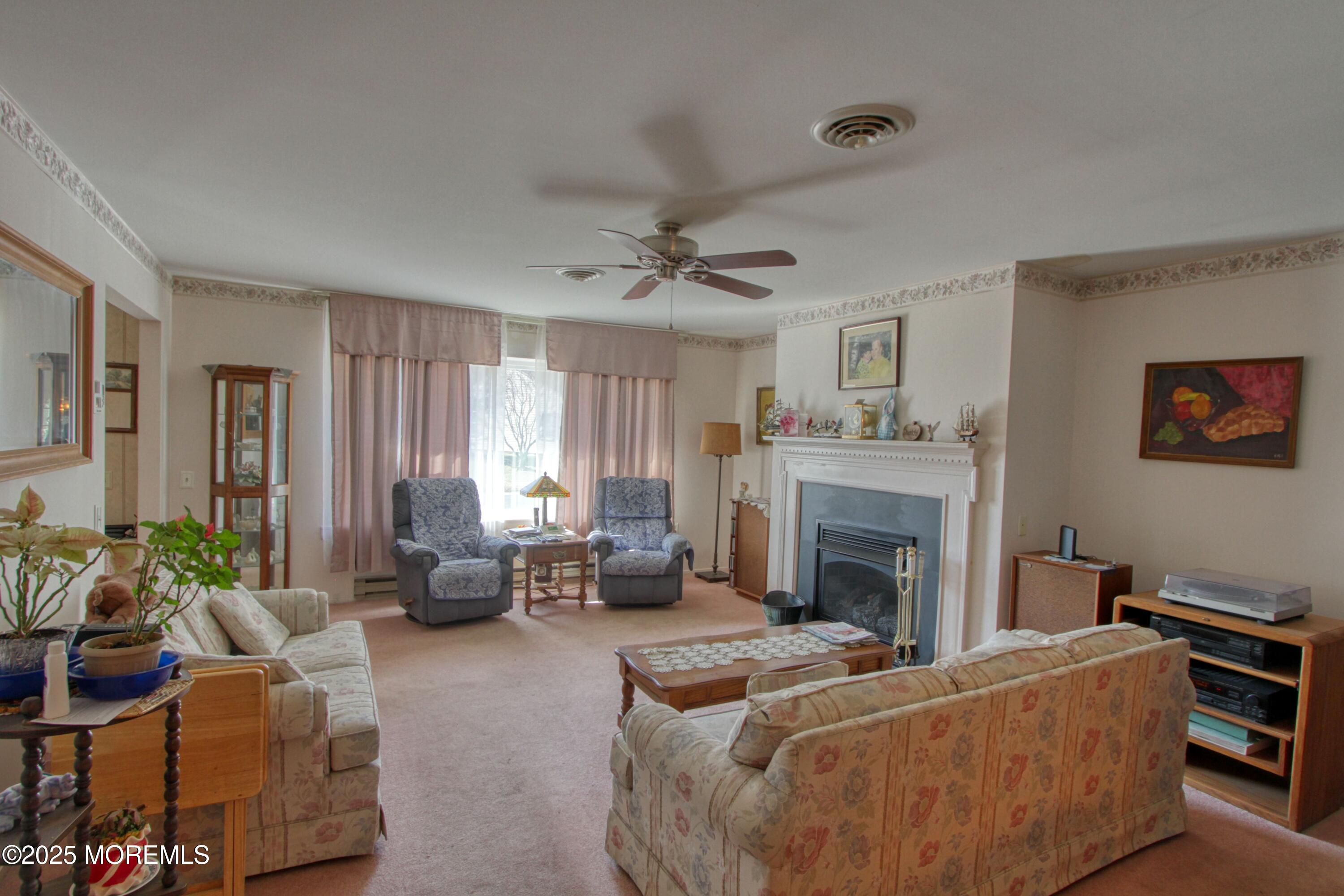 19 Amesbury Road Whiting, NJ 08759 - Photo 8 of 26 a living room with furniture and a fireplace