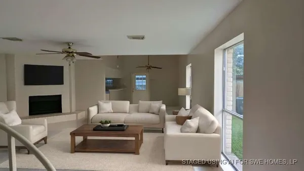 a living room with furniture and a fireplace