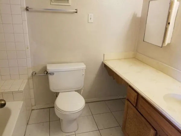 a bathroom with a toilet and a sink
