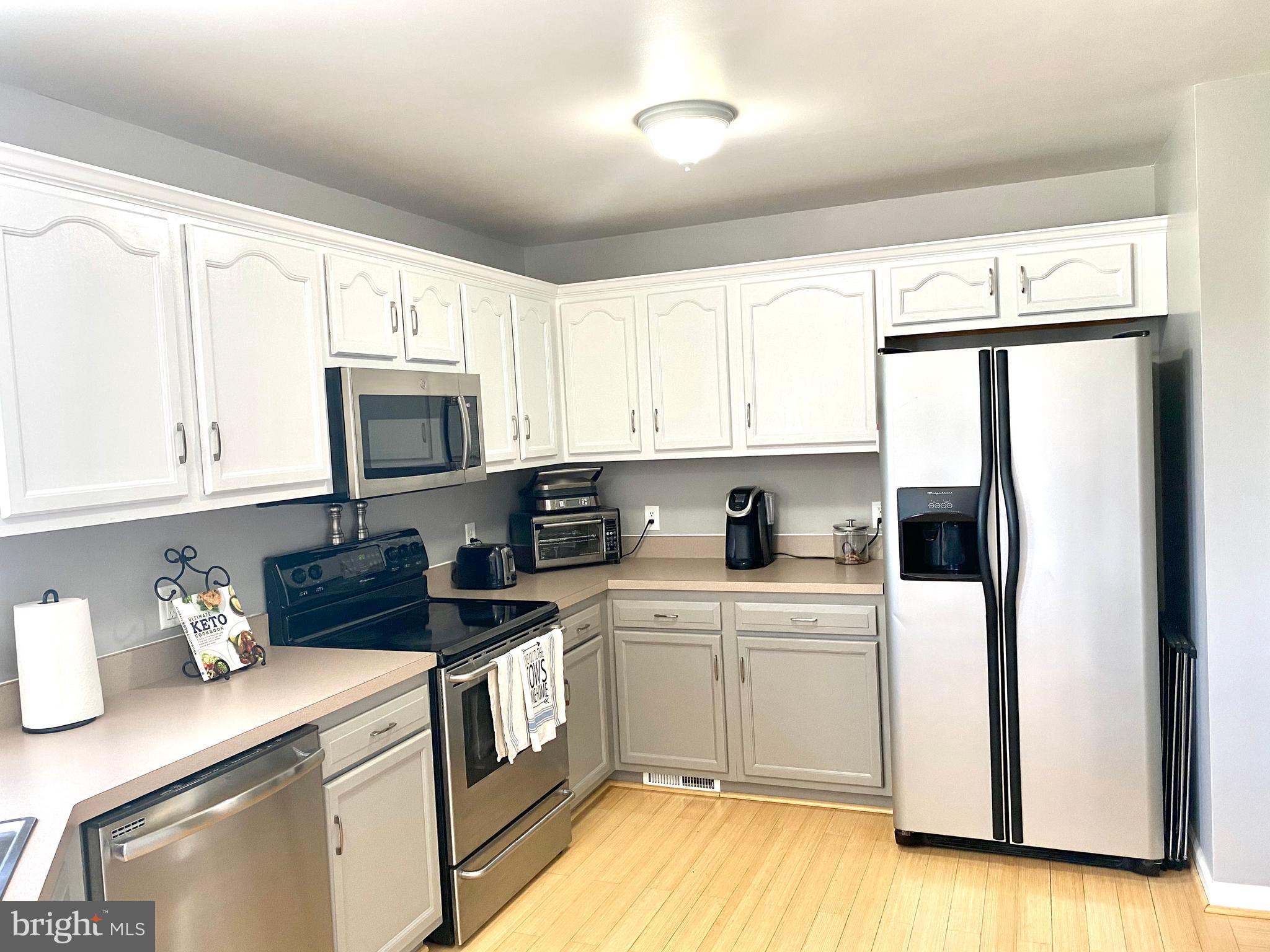 432 Thumper Drive Ranson, WV 25438 - Photo 11 of 46 Lovely cabinet colors and SS appliances