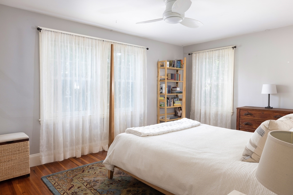 160 Allen Avenue Waban, MA 02468 - Photo 16 of 19 a bedroom with a large bed a chandelier and a window