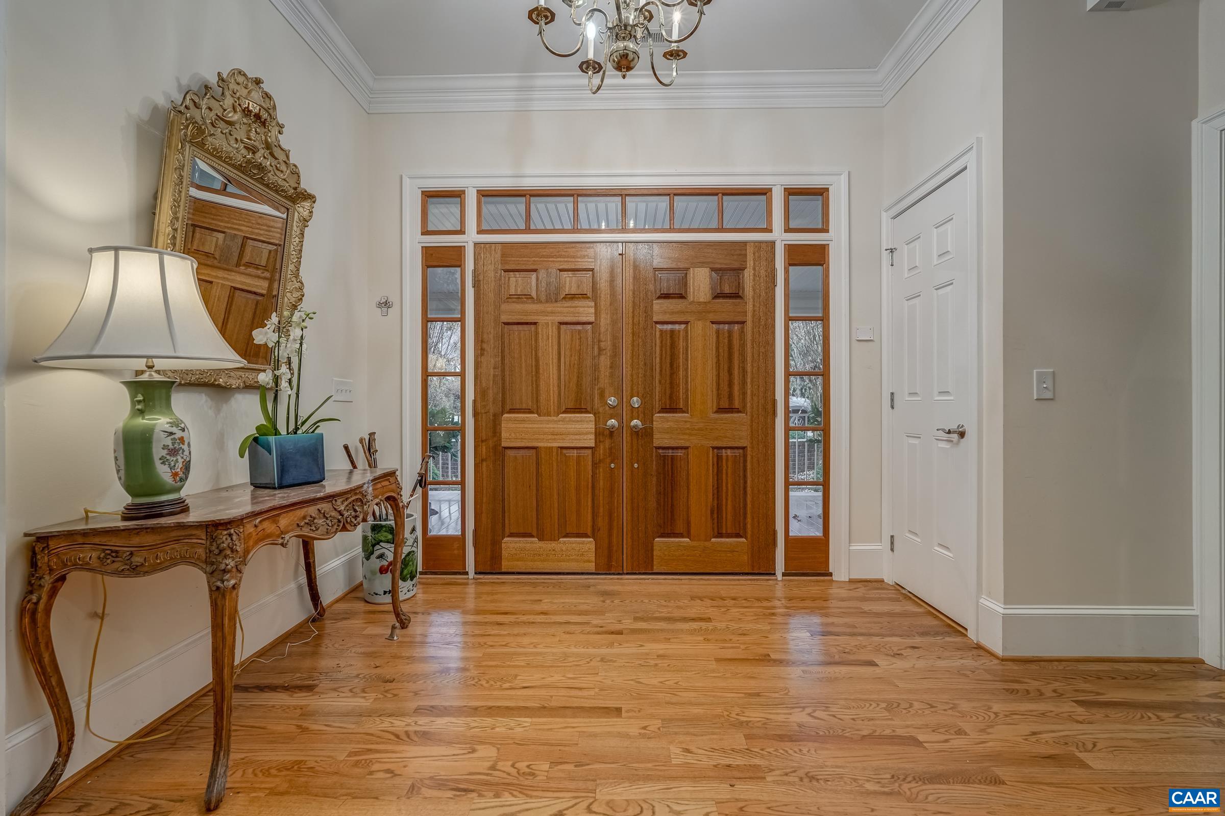 1849 Westerham Street Keswick, VA 22947 - Photo 23 of 75 a view of a hallway with wooden floor and staircase