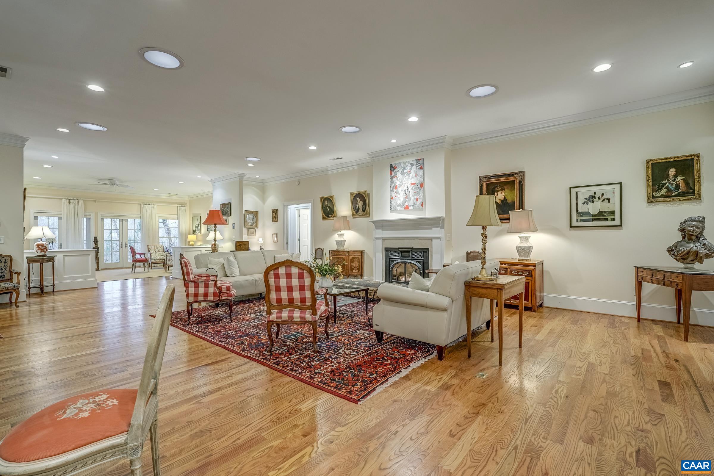 1849 Westerham Street Keswick, VA 22947 - Photo 25 of 75 a living room with fireplace furniture and a wooden floor