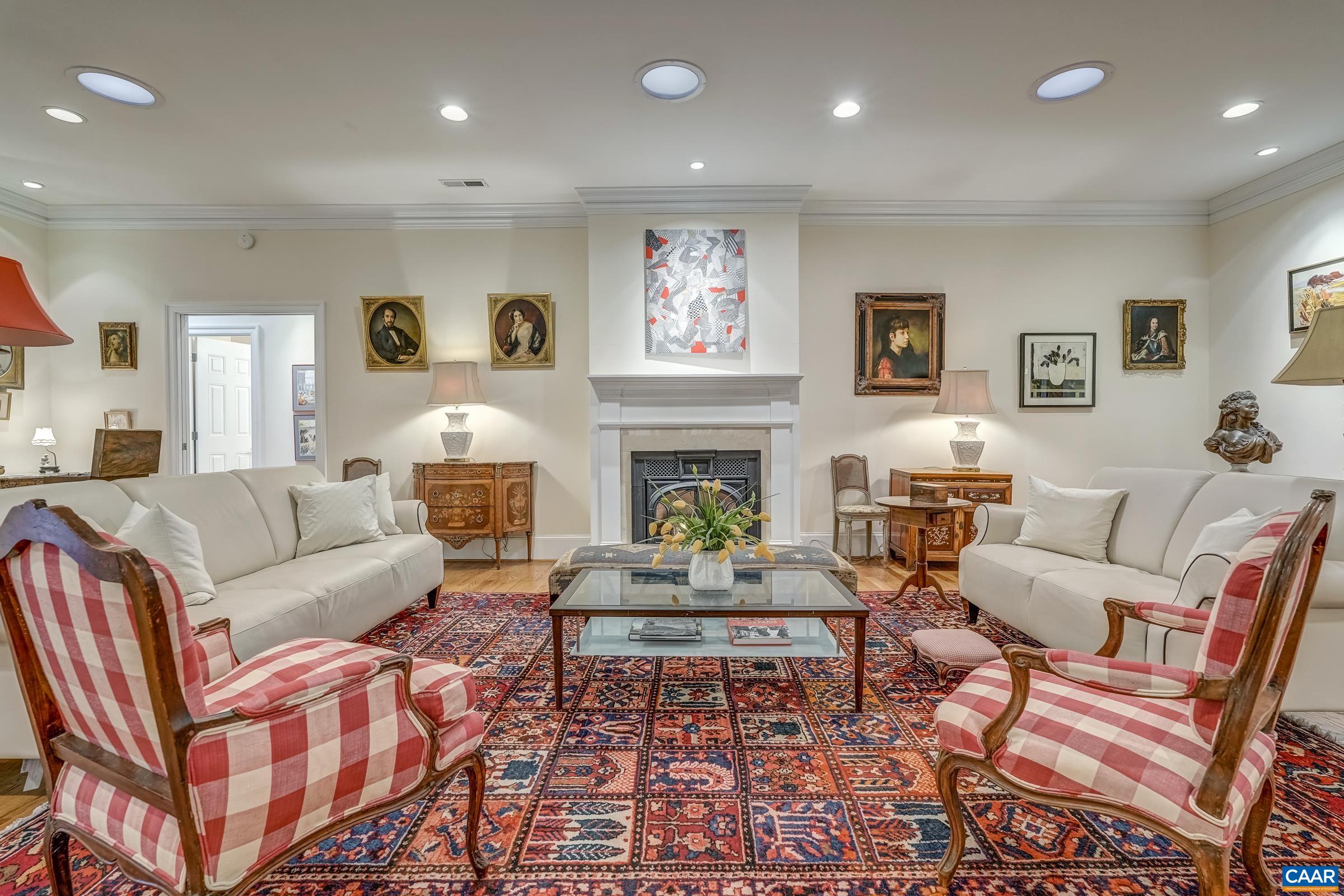 1849 Westerham Street Keswick, VA 22947 - Photo 27 of 75 a living room with furniture a fireplace and a large window