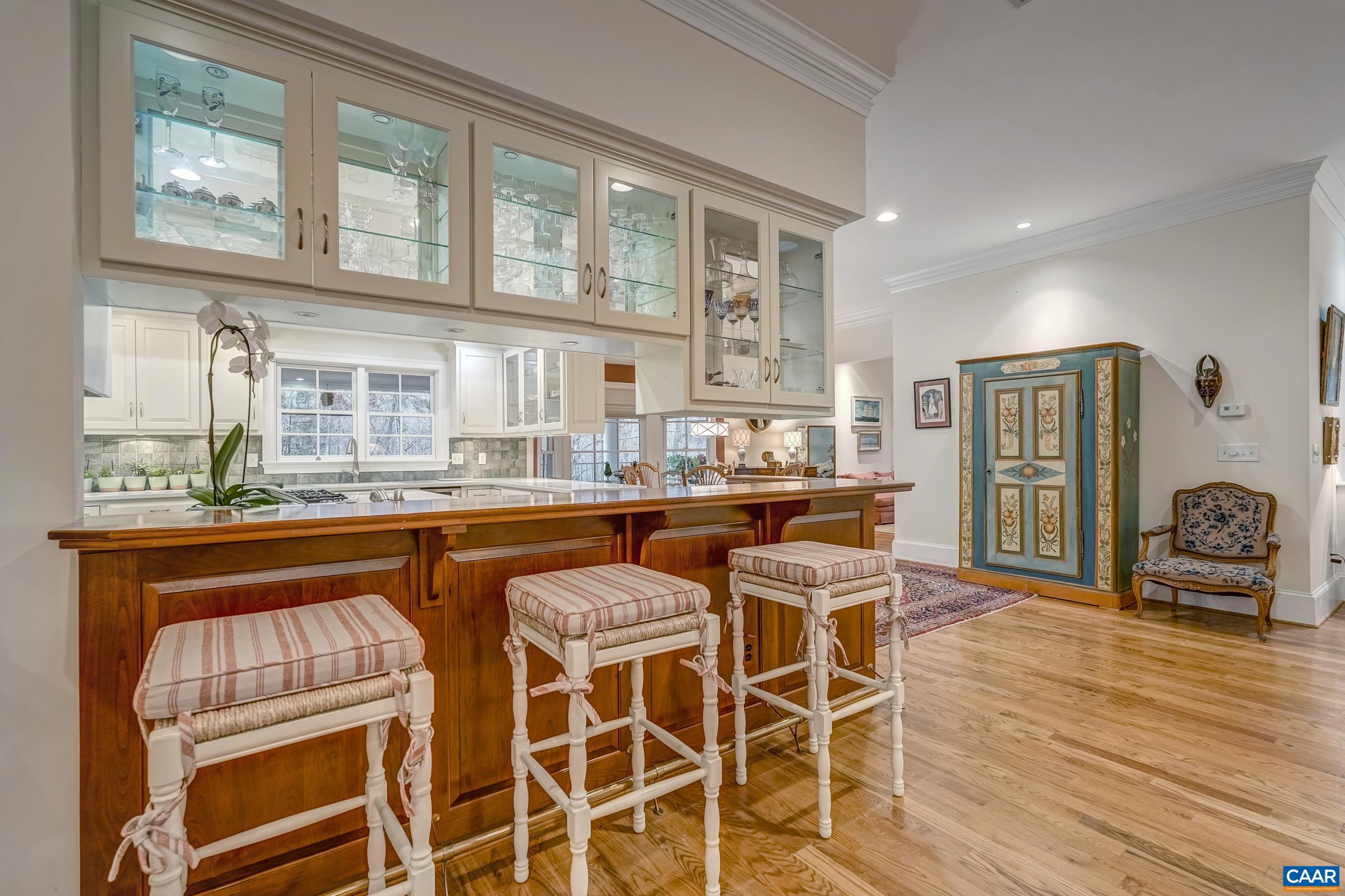 1849 Westerham Street Keswick, VA 22947 - Photo 38 of 75 a dining hall with stainless steel appliances granite countertop a stove and a chair