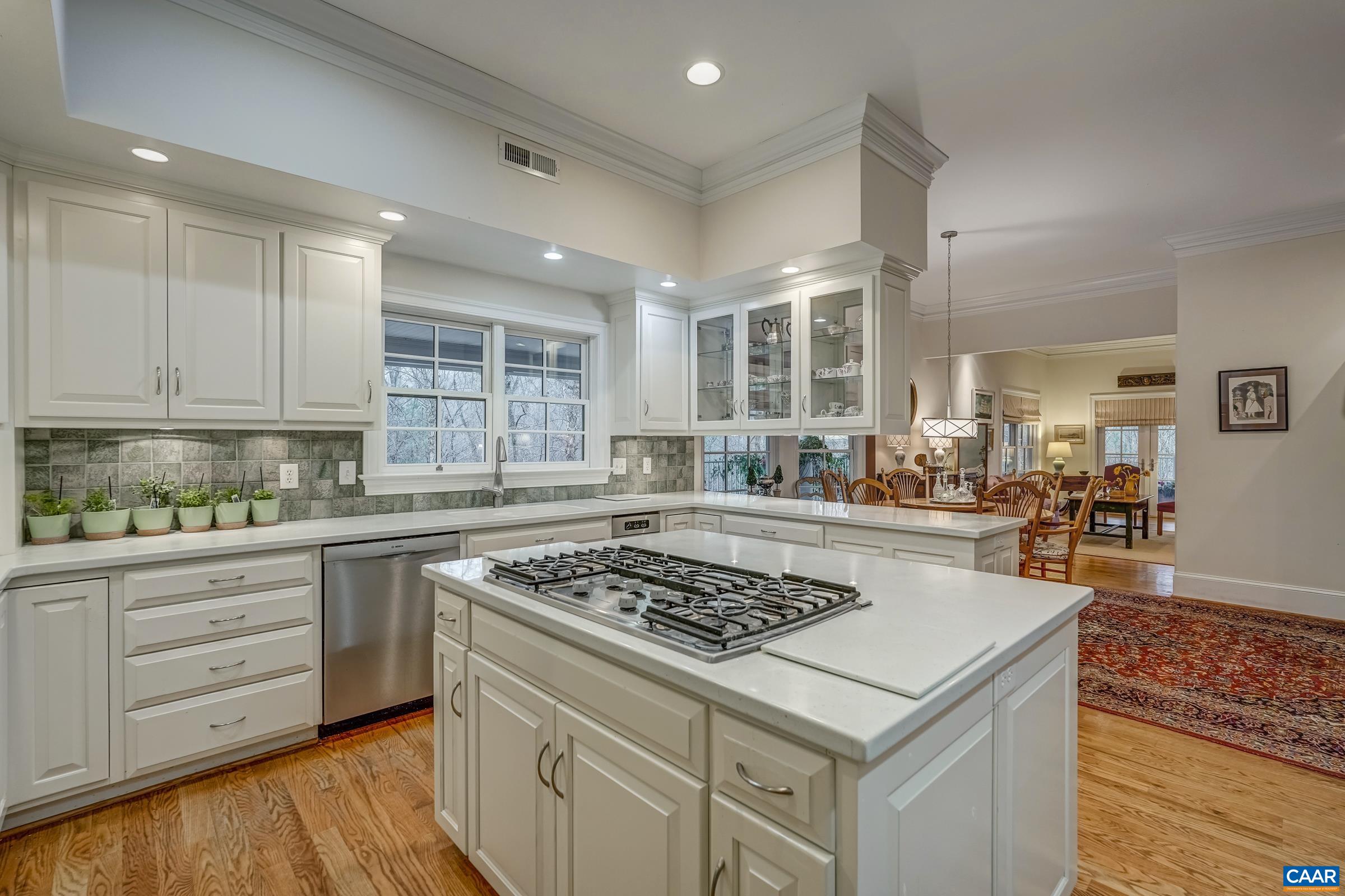 1849 Westerham Street Keswick, VA 22947 - Photo 40 of 75 a kitchen with a stove a sink and cabinets
