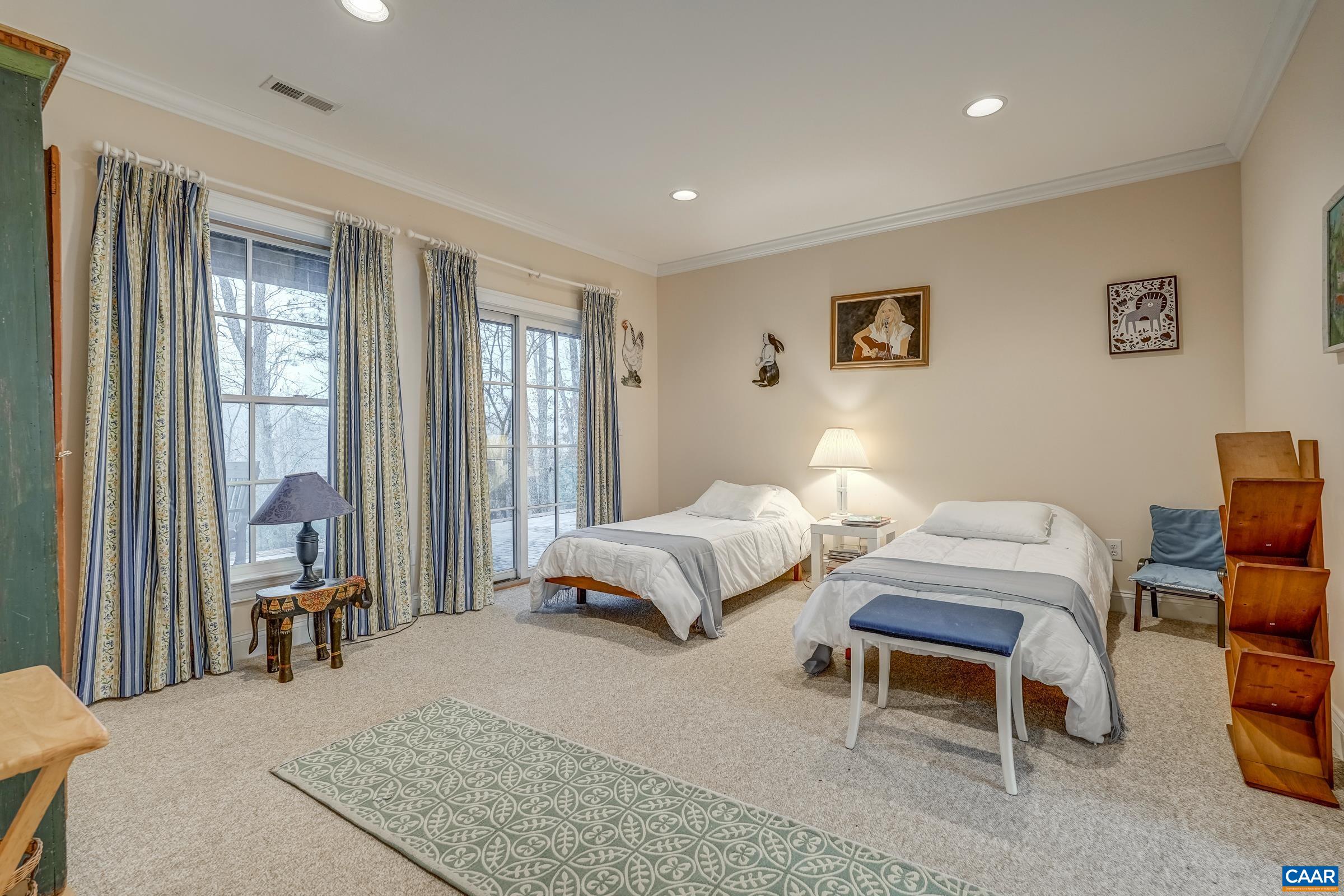 1849 Westerham Street Keswick, VA 22947 - Photo 67 of 75 a spacious bedroom with a bed and a large window