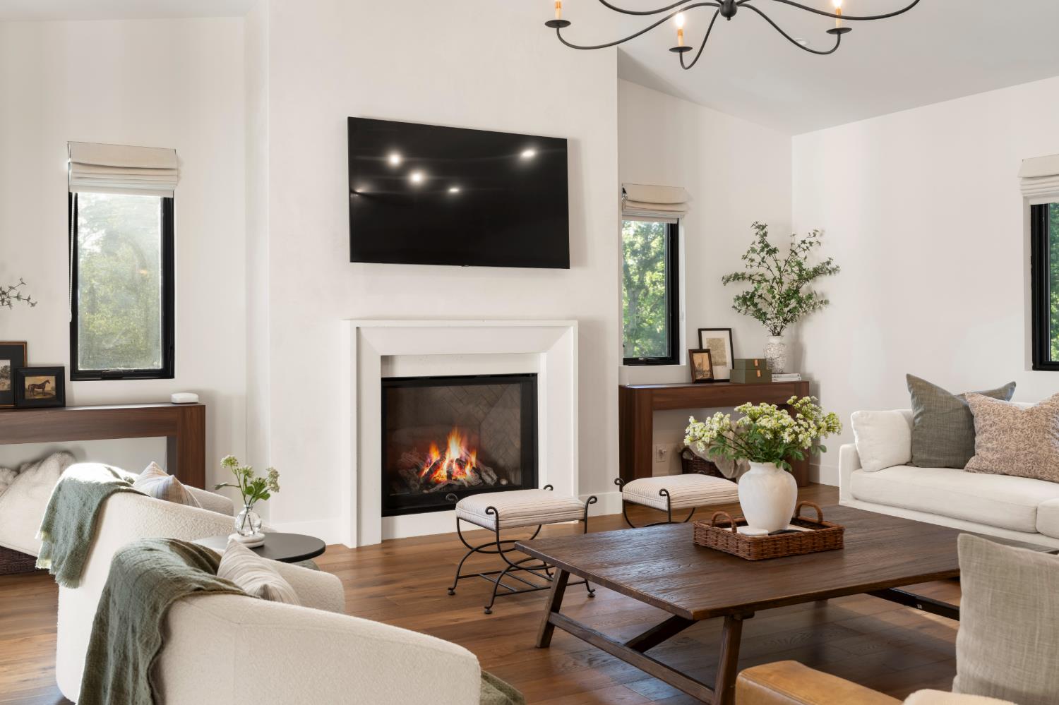7697 Horseshoe Bar Road Loomis, CA 95650 - Photo 20 of 76 a living room with furniture a fireplace and a flat screen tv