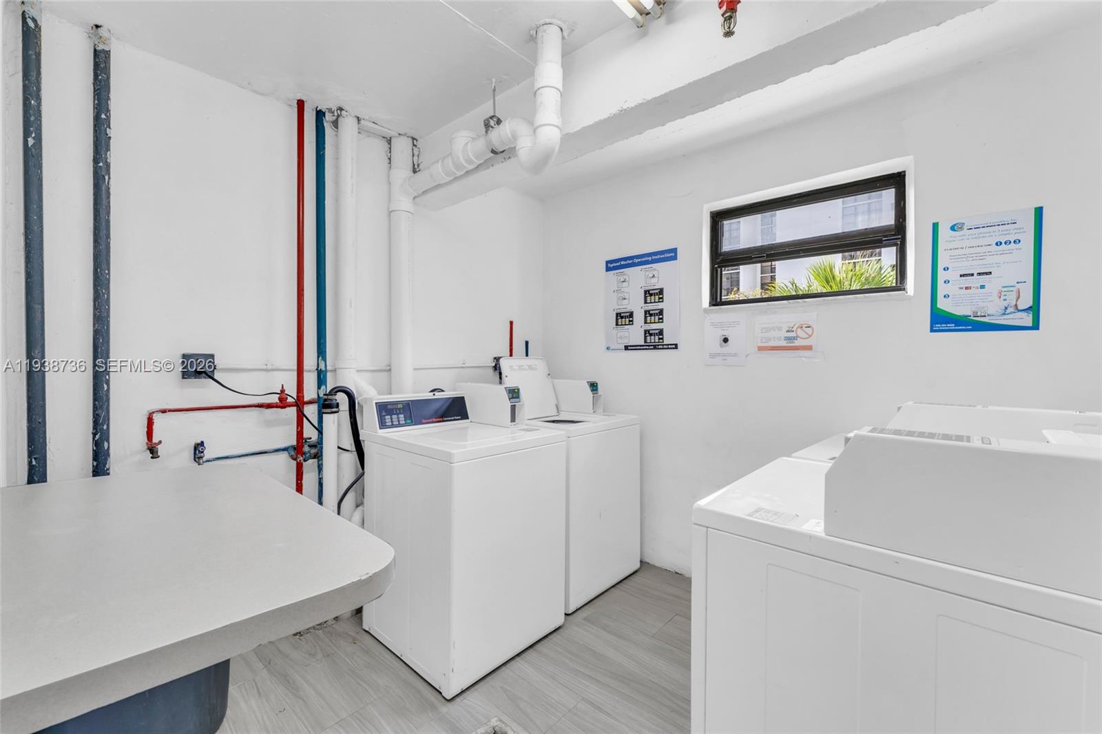 16919 North Bay Road, Unit 118 Sunny Isles Beach, FL 33160 - Photo 10 of 20 a white bath tub sitting next to a white sink