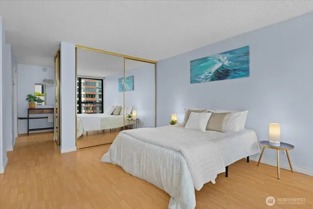 a bedroom with a bed and a lamp