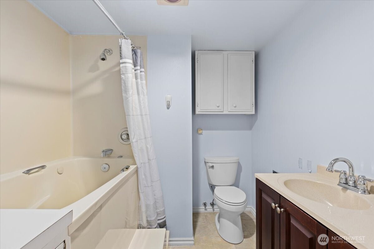 2100 3rd Avenue, Unit 2505 Seattle, WA 98121 - Photo 20 of 40 a bathroom with a sink a toilet and shower