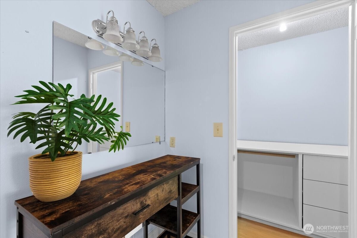 2100 3rd Avenue, Unit 2505 Seattle, WA 98121 - Photo 21 of 40 a vase of flowers sitting on a table with a potted plant