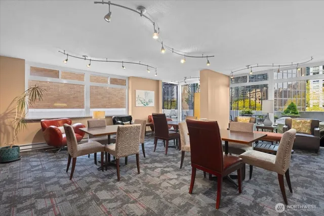 a view of a patio with table and chairs and potted plants