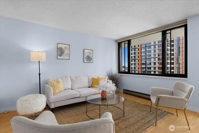 a living room with furniture and a large window